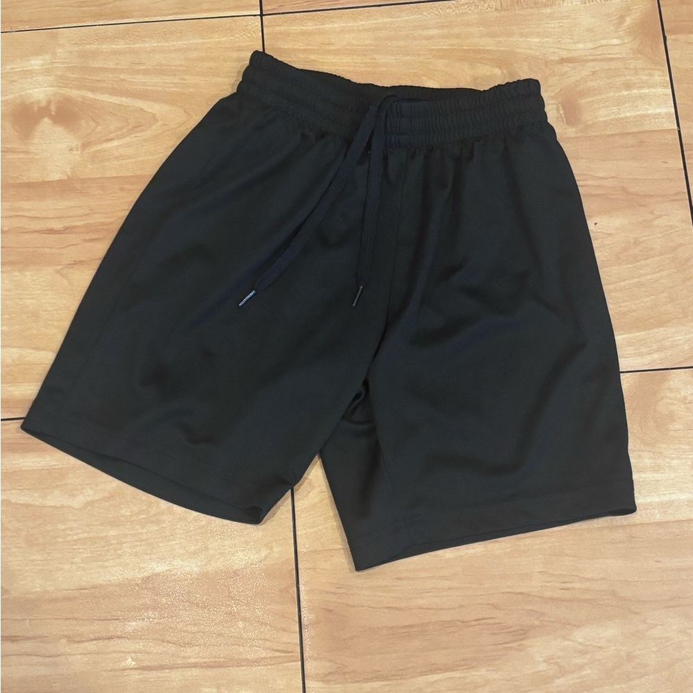 Girls black spots shorts. Long and great for soccer or basketball!